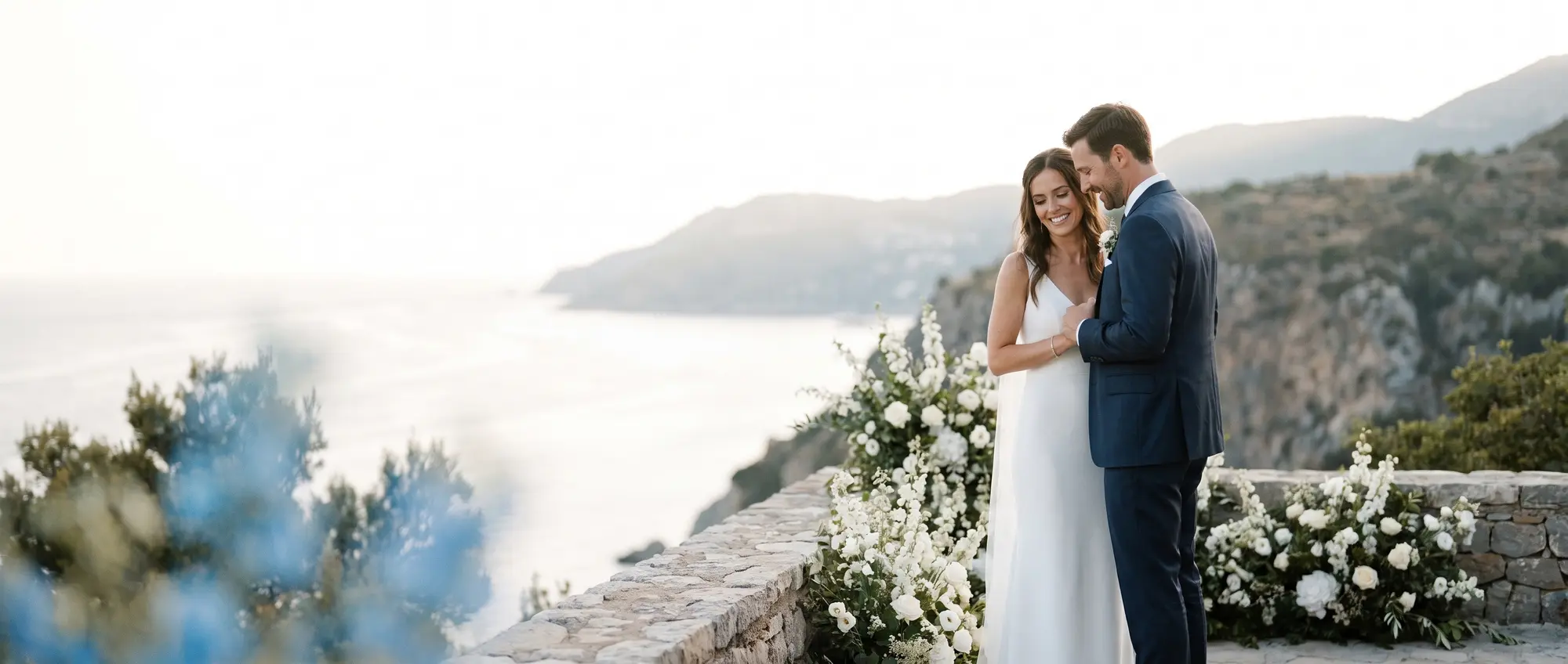 A couple celebrating at an outdoor wedding venue, protected by eWed event insurance